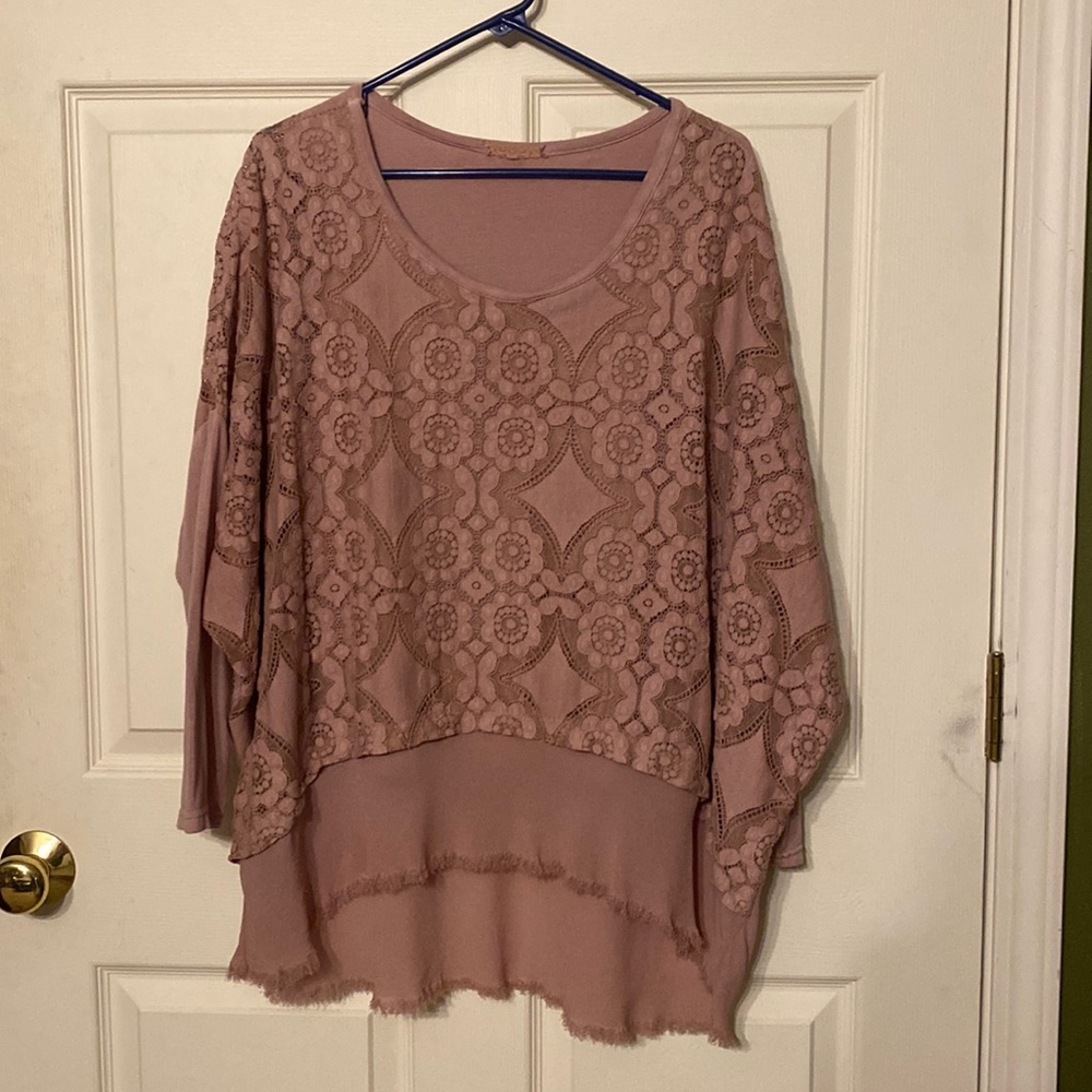 Pullover shirt is made of chiffon like material & a layer of lace over that.